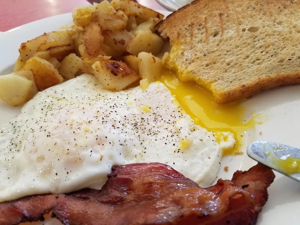 Eggs over Easy with Bacon Home Fries and Rye Toast